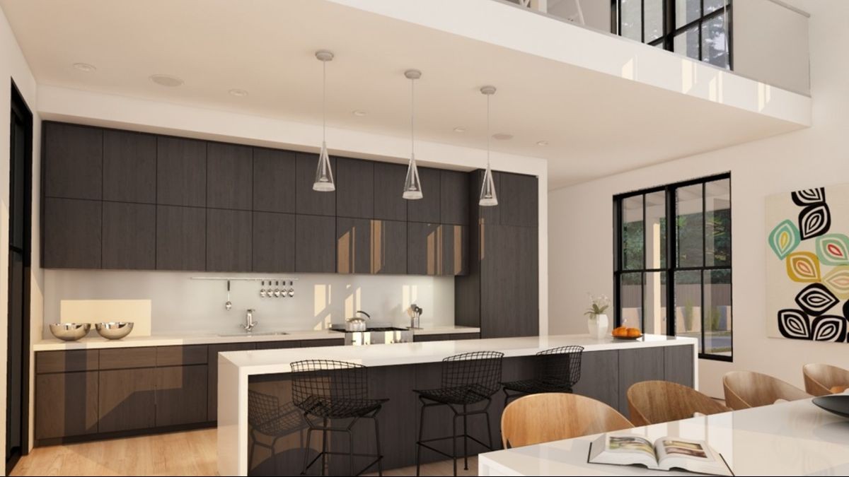 The kitchen with large kitchen island The kitchen island separates the cooking area from the living room and it will be a great place for breakfast and snacks.