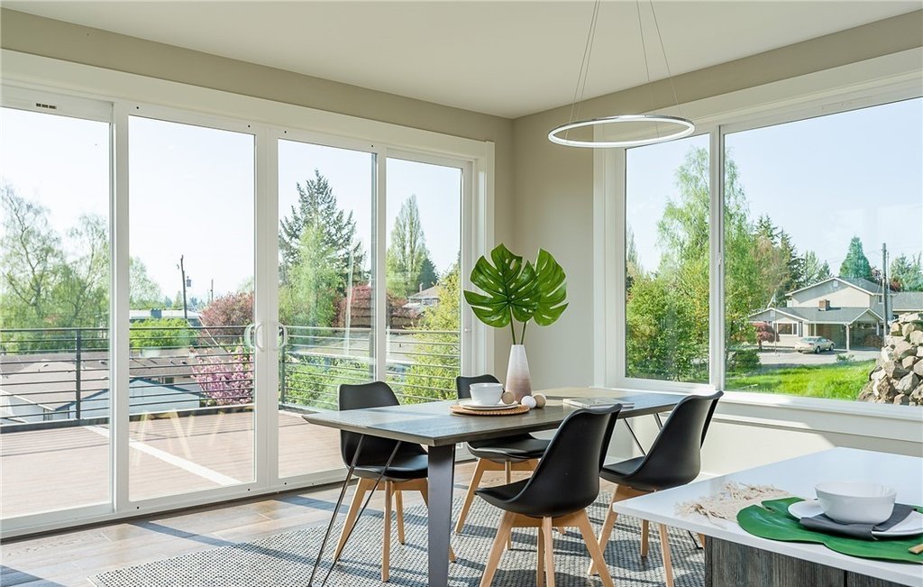 Dining Room with corner sliding doors and windows